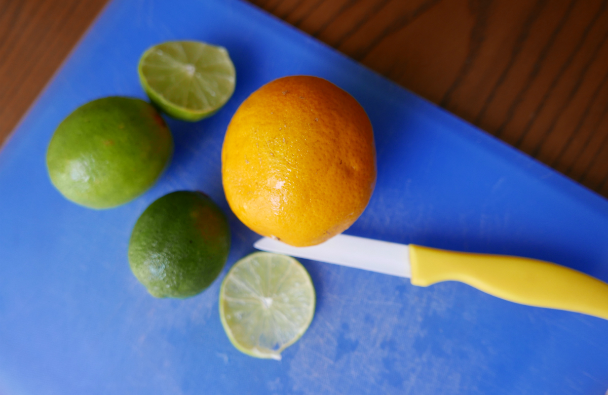 Citrus fruits on chopping board