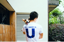Man holding corgi in his arms